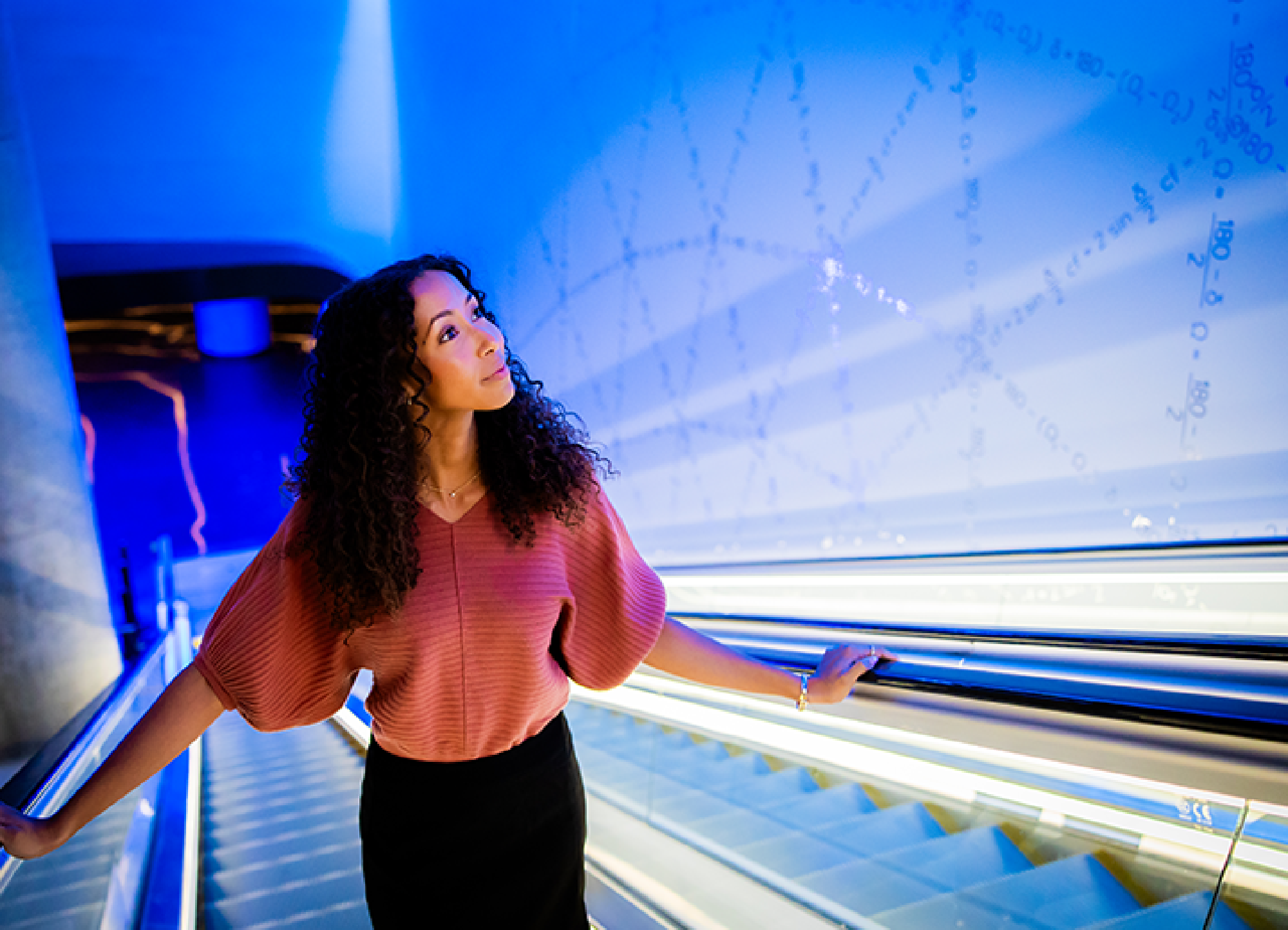 A woman is immersed in an atrium filled with 22nd century technology  at The Sphere, Las Vegas, Nevada.