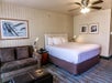 One king bed and sofa bed inside a guest room.