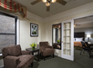 Living room with comfortable sofa chairs inside a guest room.