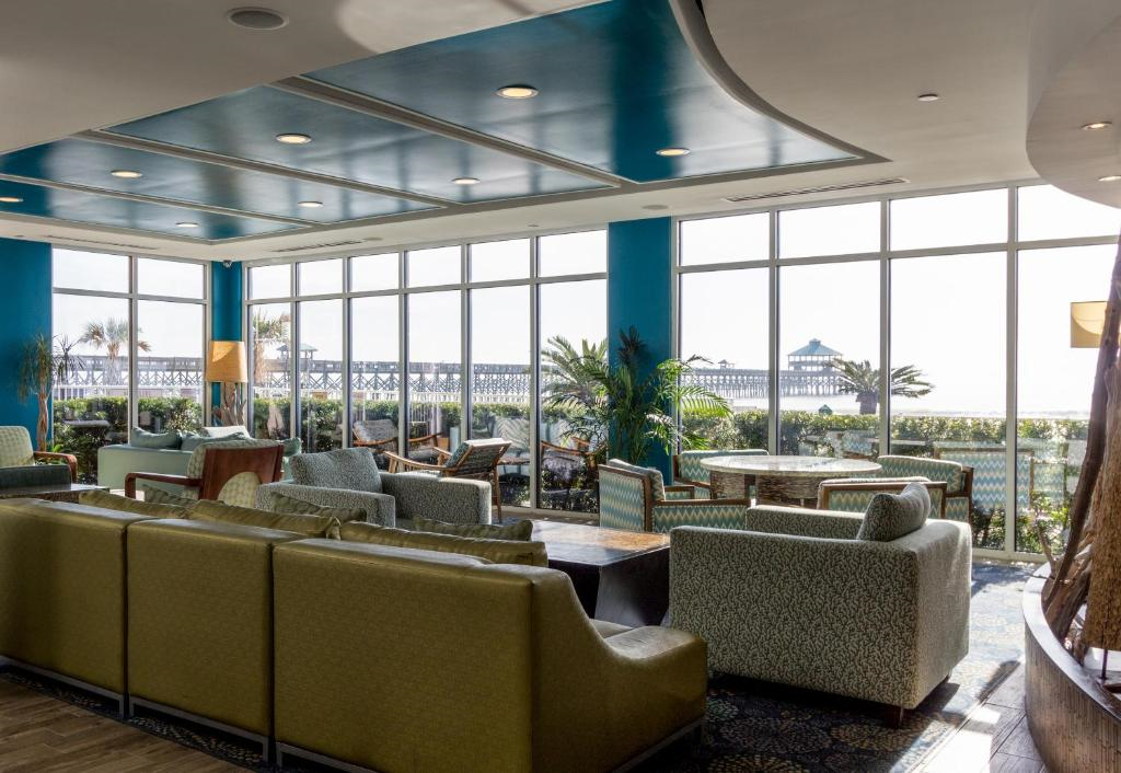 Lounge area with ocean view and large windows