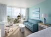 Seating area with balcony and ocean view