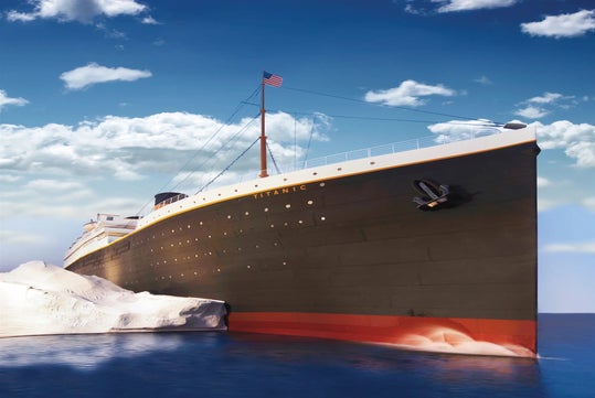 The RMS Titanic collides with a large iceberg in the ocean under a partly cloudy sky, with an American flag flying atop its mast.