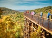 People enjoy the view of the Ozark Mountains at Top of the Rock in the Autumn.