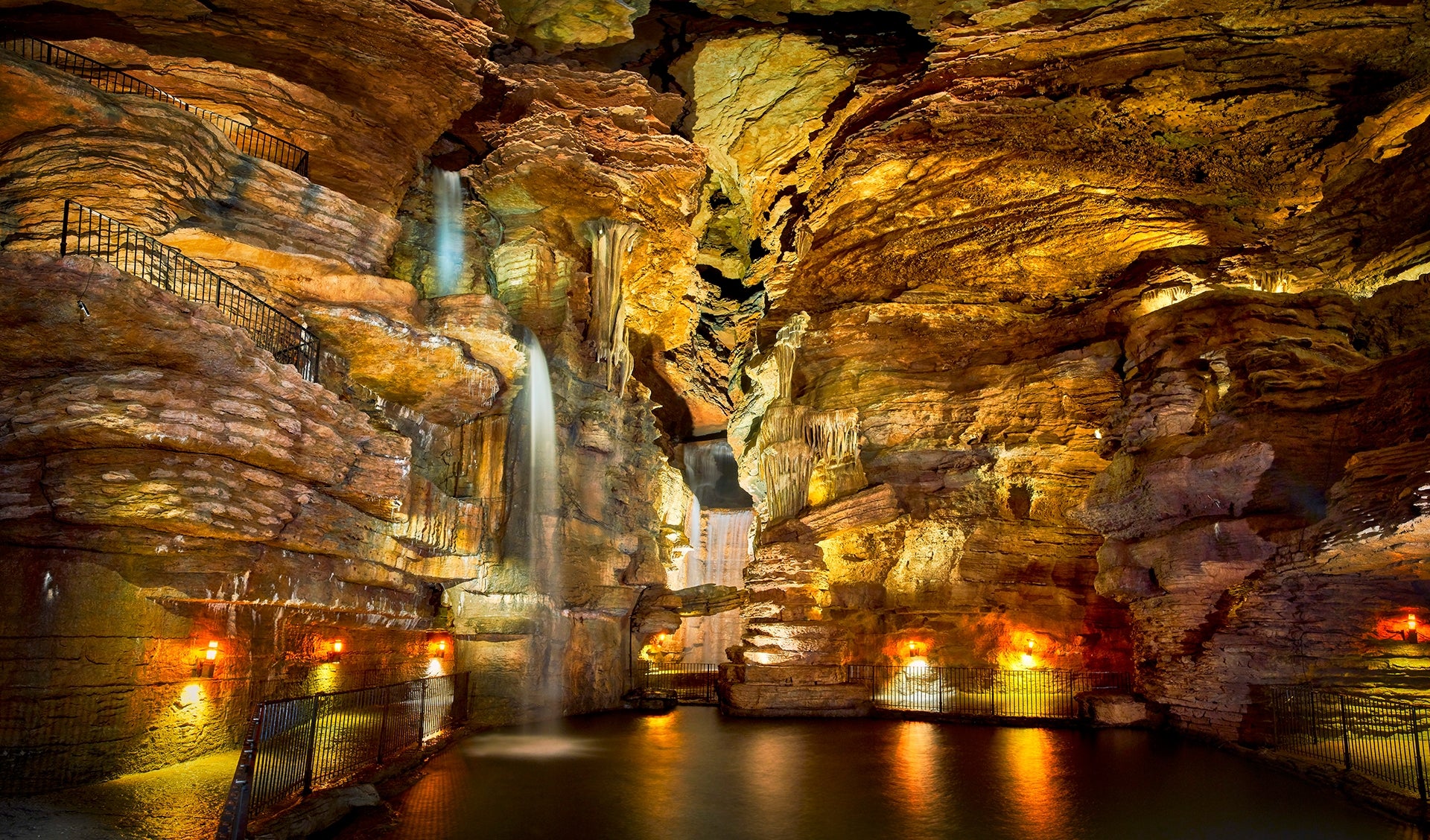 Lost Canyon Cave with waterfalls cascading down.