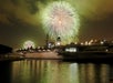 The USS Midway with fireworks in the background in San Diego, CA.