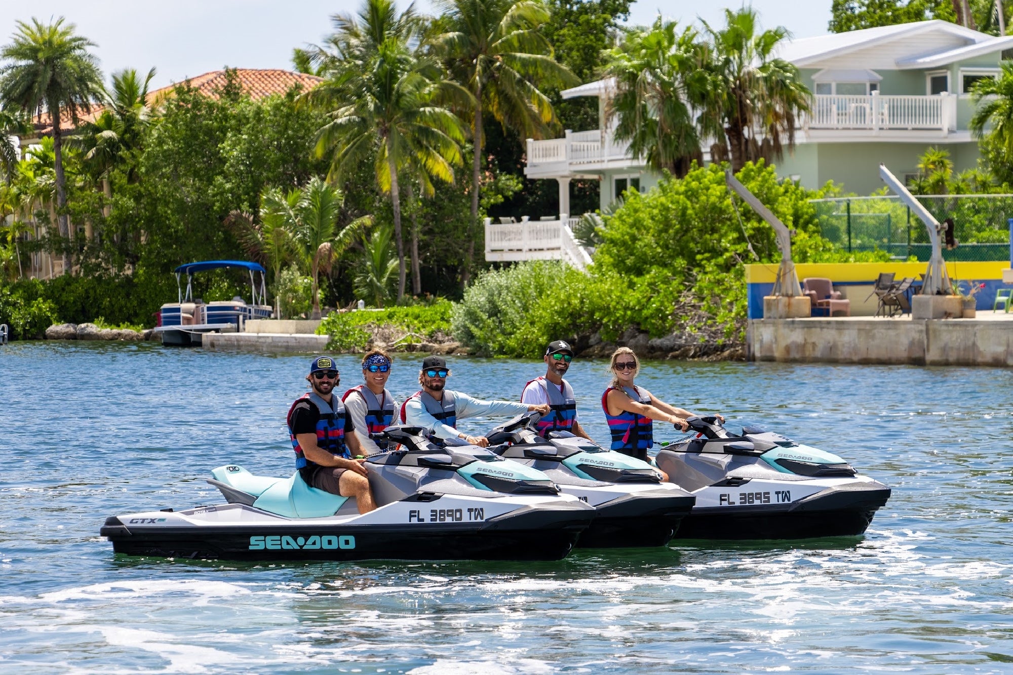 Friends are ready to ride in the calm marina waters.