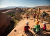 The group all making up this steep hill to the zipline on the Ultimate Zip Line Adventure Moab Utah.
