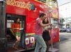 A cheerful passenger disembarking from the City Sightseeing bus.