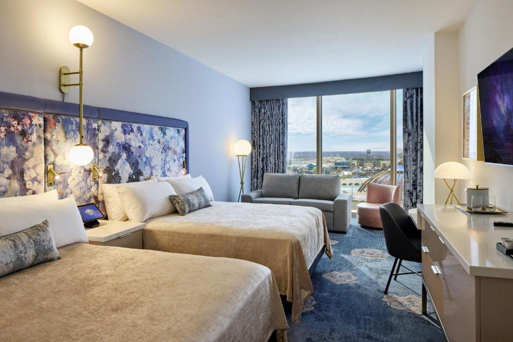 Guest room with view of the park, two queen beds, and a sofa bed