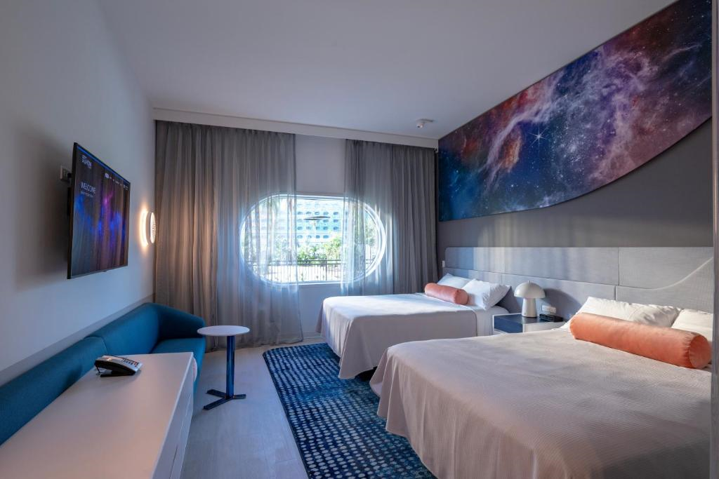 Space-themed guest room with two queen beds