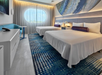 Space-themed guest room with two queen beds