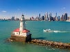 A light house with the cruise ship and Chicago in the background on the Urban Adventure Cruise in Chicago, Illinois, USA.