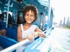 A girl on the cruise ship holding the side railing on the Urban Adventure Cruise in Chicago, Illinois, USA.