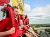 People riding the Power Tower and laughing at Valleyfair in Bloomington, Minnesota.