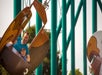 A father and son laughing while riding the Flying Eagles at Valleyfair in Bloomington, Minnesota.