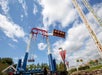 View looking up at the Xtreme Swing in motion on a sunny day at Valleyfair in Bloomington, Minnesota.