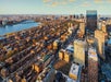 View looking over the city of Boston at sunset from the View Boston Observatory.