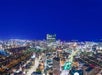 View of the Boston skyline full of lights at night from the View Boston Observatory.