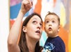 A woman with a child at the Children's Museum of Houston in Houston, Texas.