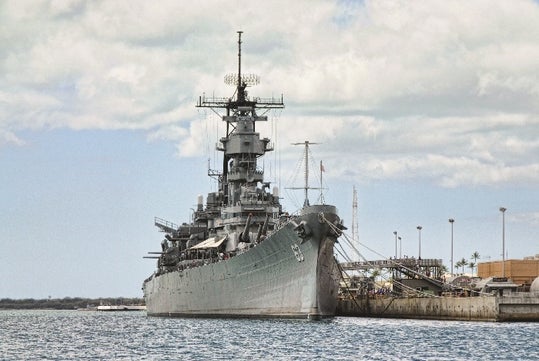 A wider view of the beautiful USS Missouri anchored in Pearl Harbor, Hawaii.