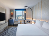 Cozy room featuring one king bed, a comfortable seating area, and a flat-screen TV for ultimate relaxation.