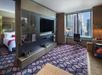 Living area, sofa bed, flat-screen TV at W New York Times Square, NY.