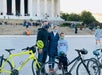 A family taking photos in front of Lincoln Memorial in Washington DC