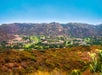 View of the resort from afar with the hills of Escondido surrounding the resort.
