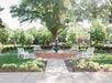Courtyard with a fountain and seating area.