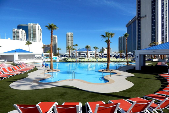 Refreshing outdoor pool with sun lounges.