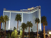 Majestic hotel exterior surrounded with trees.