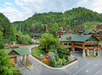 Beautifully landscaped resort exterior and view of the mountains.