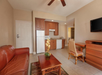 A cozy living space with a convenient kitchenette.