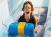 A young boy screaming while going down a water slide at White Water in Branson, Missouri.