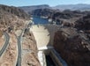 Aerial view looking down on the Hoover Dam on a sunny day.