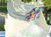A group of people in a tube on Hurricane Falls at Oceans of Fun amusement park in Kansas City, Missouri.