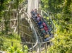 A car full of people going around a corner on the Prowler roller coaster at Worlds of Fun amusement park in Kansas City, Missouri.