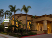 Hotel exterior at dusk.