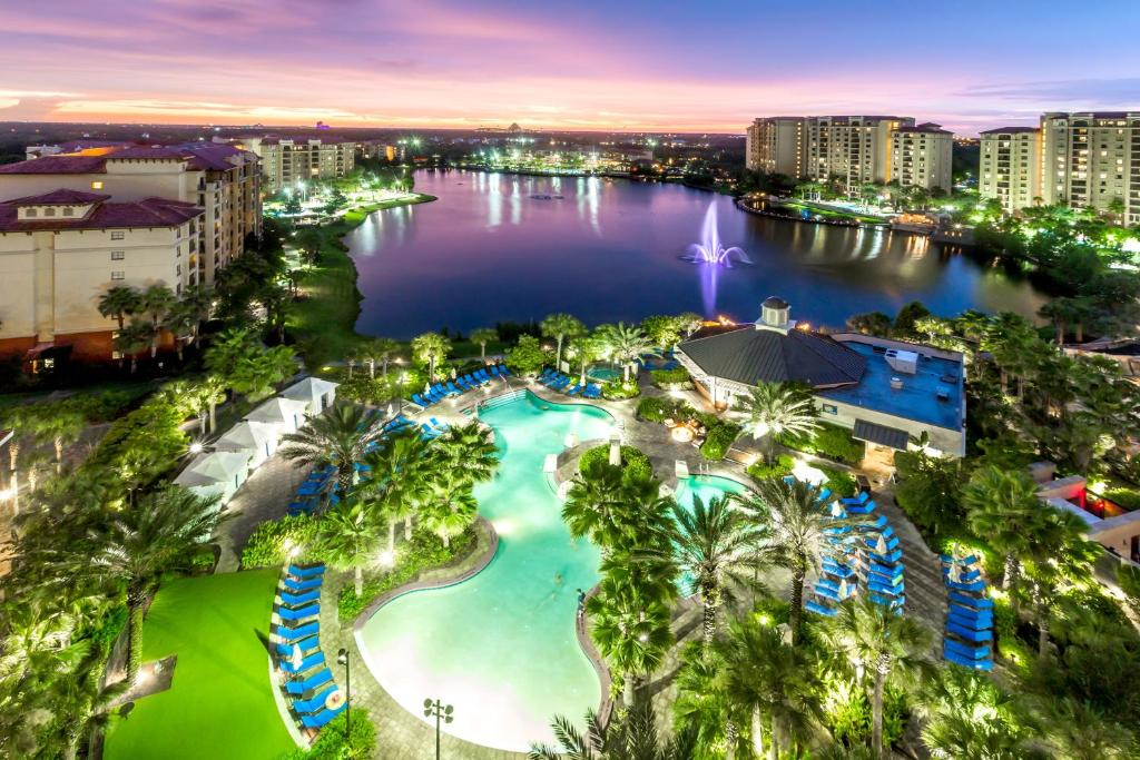 Aerial view for the resort, pool area and the lake at night
