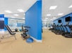 Fitness Center with cardio equipment and free weights.