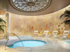On-site jacuzzi with poolside chairs.