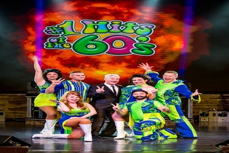 Cast members doing a pose at #1 Hits of the 60s show.