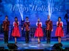Three women in red dresses and three men in red and black suit jackets alternated on stage performing at #1 Hits of the 60's.