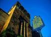 Outside view of the Eastern State Penitentiary in Philadelphia, Pennsylvania with a signage that provides information about the prison's design and its significance as a model for over 300 prisons worldwide.
