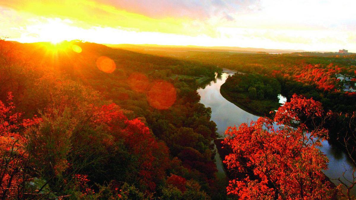 Sunset over the Ozark Mountains with vibrant fall foliage in Branson, Missouri.