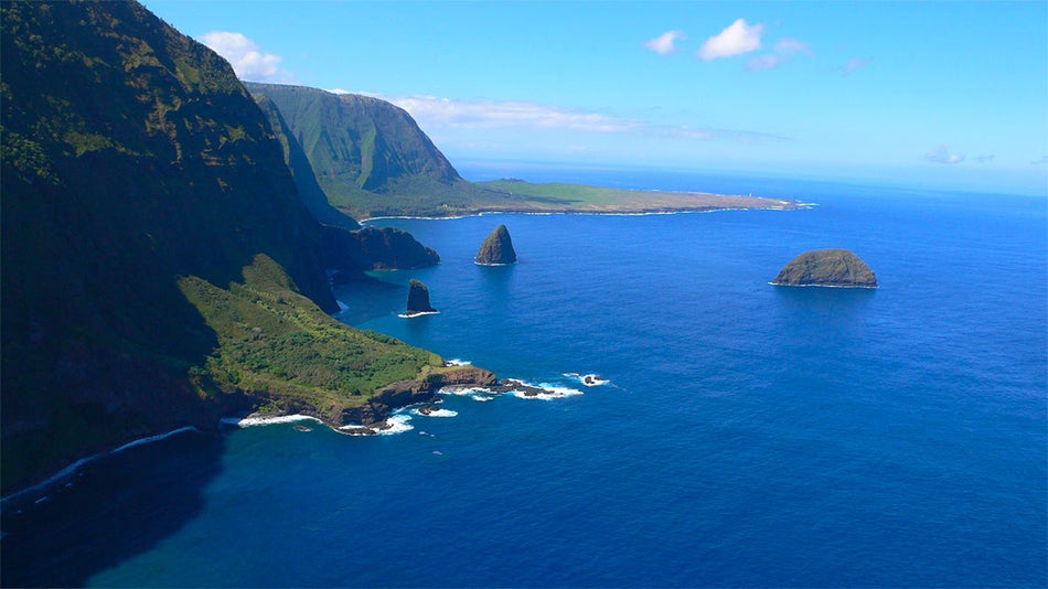 view of blue ocean with hills and trees in Kalaupapa National Historical Park at Molokaʻi, Hawaii, USA