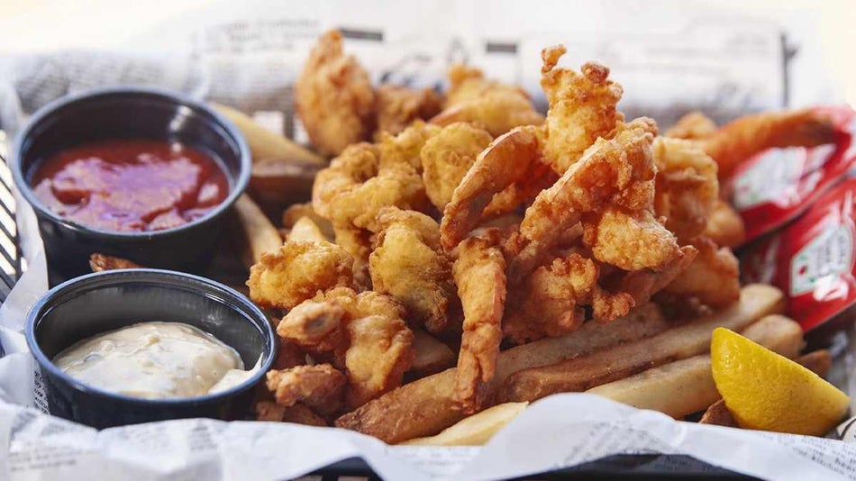 Close up of fried shrimp with fries in a basket at Bubba's Love Shak in Myrtle Beach, South Carolina, USA