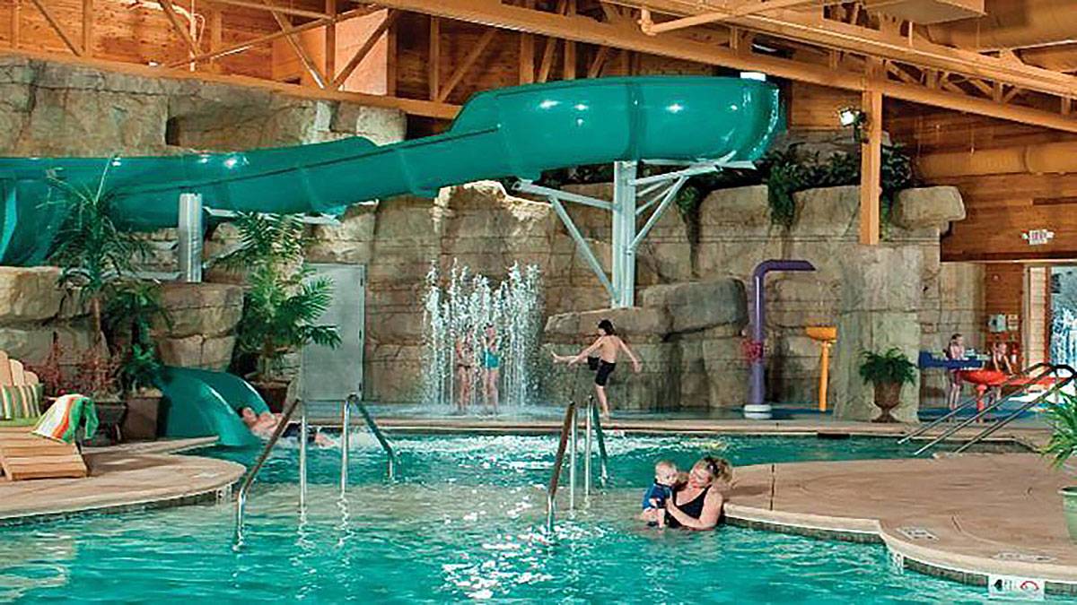 interior pool view with families in Welk Resorts Branson at The Lodges at Timber Ridge in Branson, Missouri, USA