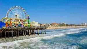 close up of ferris wheel and pier with ocear at Santa Monica Pier in Los Angeles, California, USA