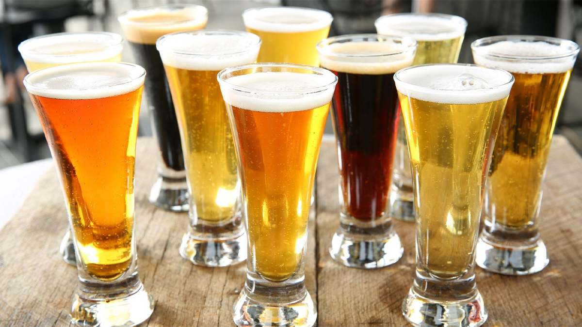 Glasses full of different beers on a table at Smoky Mountain Brewery - Gatlinburg, Tennessee, USA